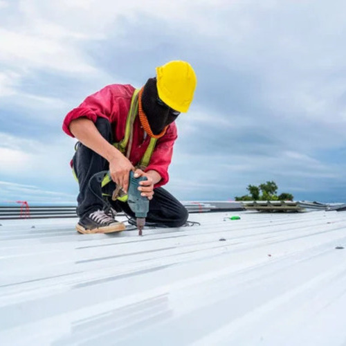 roofer repairing a commercial roof