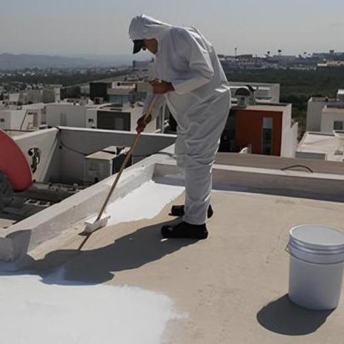 worker applying an elastomeric coating