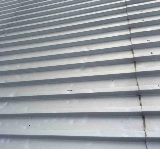 metal roofing damaged by hail