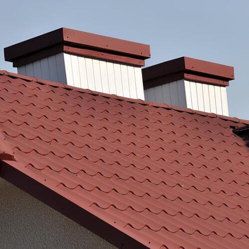 a reddish brown stone coated steel roof